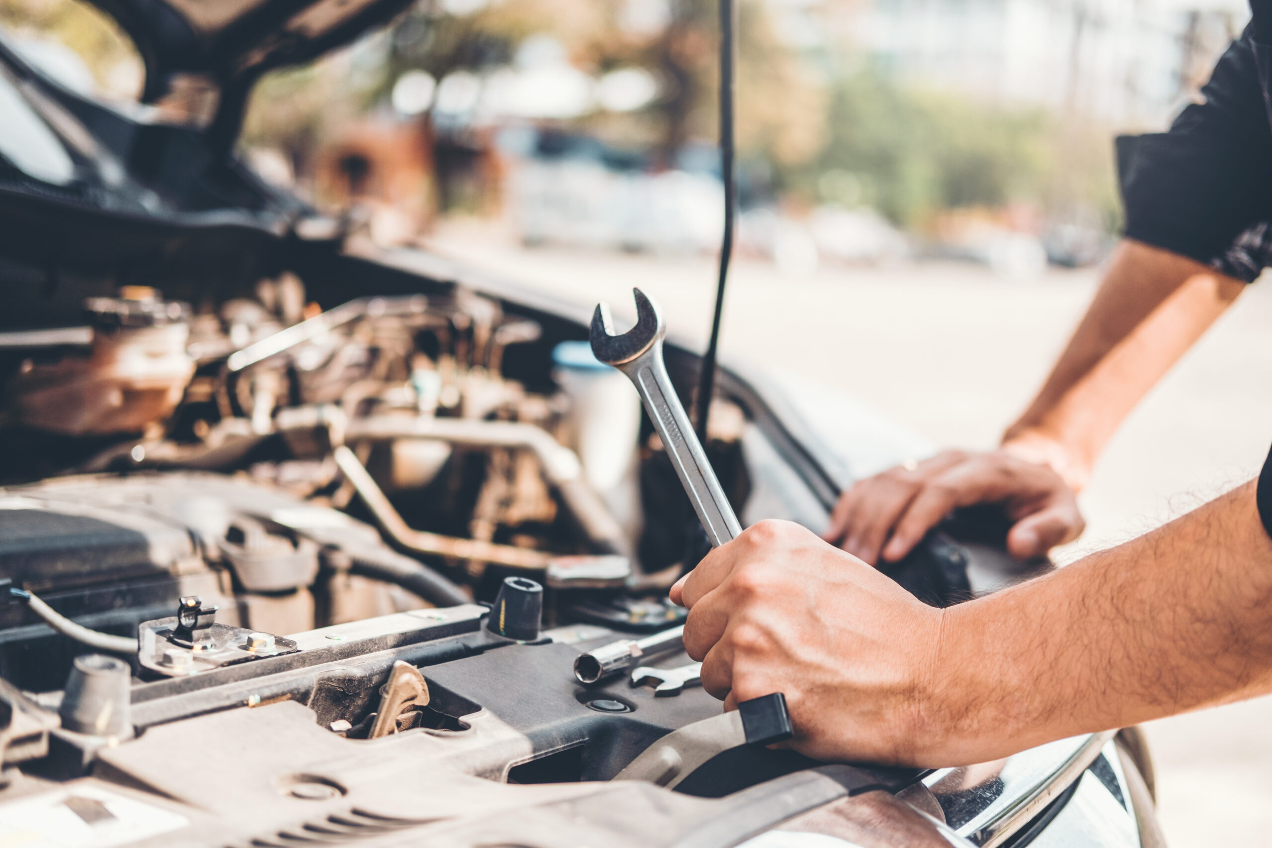 Auto mechanic working in garage Technician Hands of car mechanic